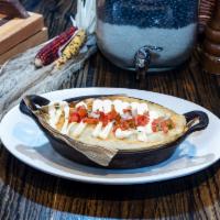 Shea's Tamale Pie · Urban Rio's pot pie, fresh masa dough, filled with grilled chicken, chipotle crema, peppers,...