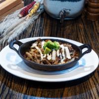 Pork Carnitas · Seared, roasted chili pork and caramelized onion served over Rio rice and borracho beans and...