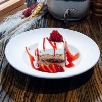 Tres Leches Cake · House-made vanilla cake soaked with tres leches.