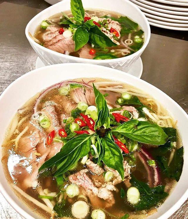 Pho '84 · Beef bone broth, certified Angus beef, eye of round rare steak, sliced Thai chili, rice noodles, red onion, bean sprouts, scallion, Thai basil and cilantro. Gluten free.