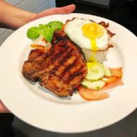 Grilled Pork Chop No.5 and Eggs · Grilled house marinated center cut pork chop, fried eggs, pickled veggies and white rice.