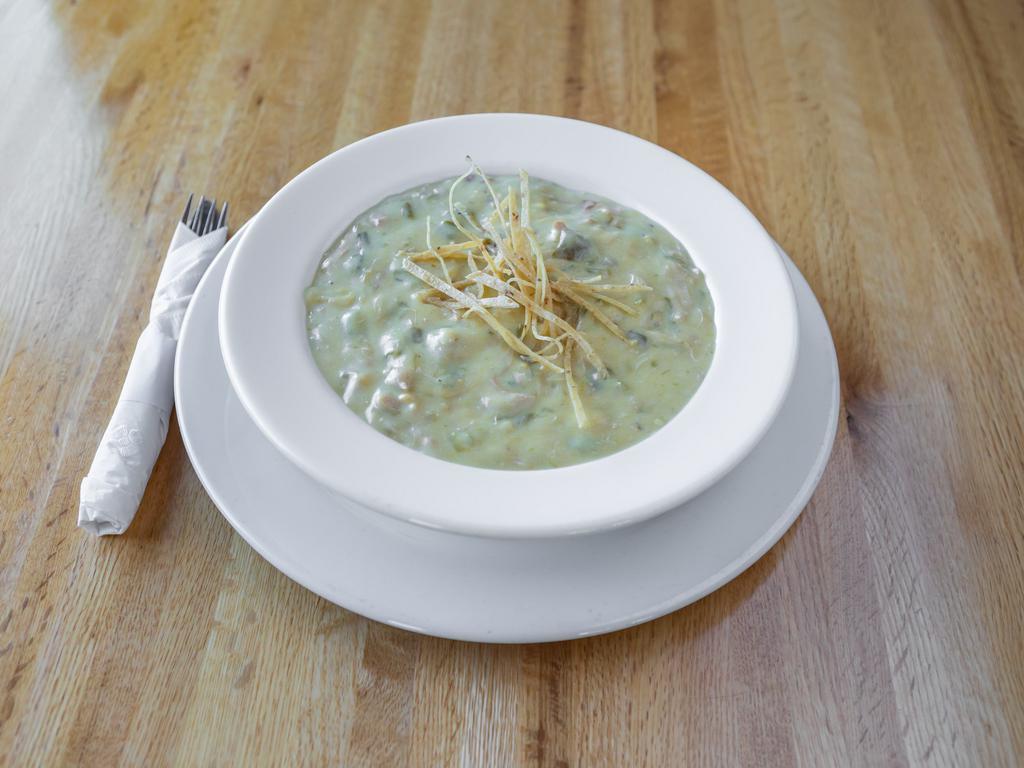 Frank Sr's Creamy Green Chile Chicken Soup · A creamy chile chicken and mushroom soup, filled with shredded chicken and New Mexico green chile, served with 1 sopapila.