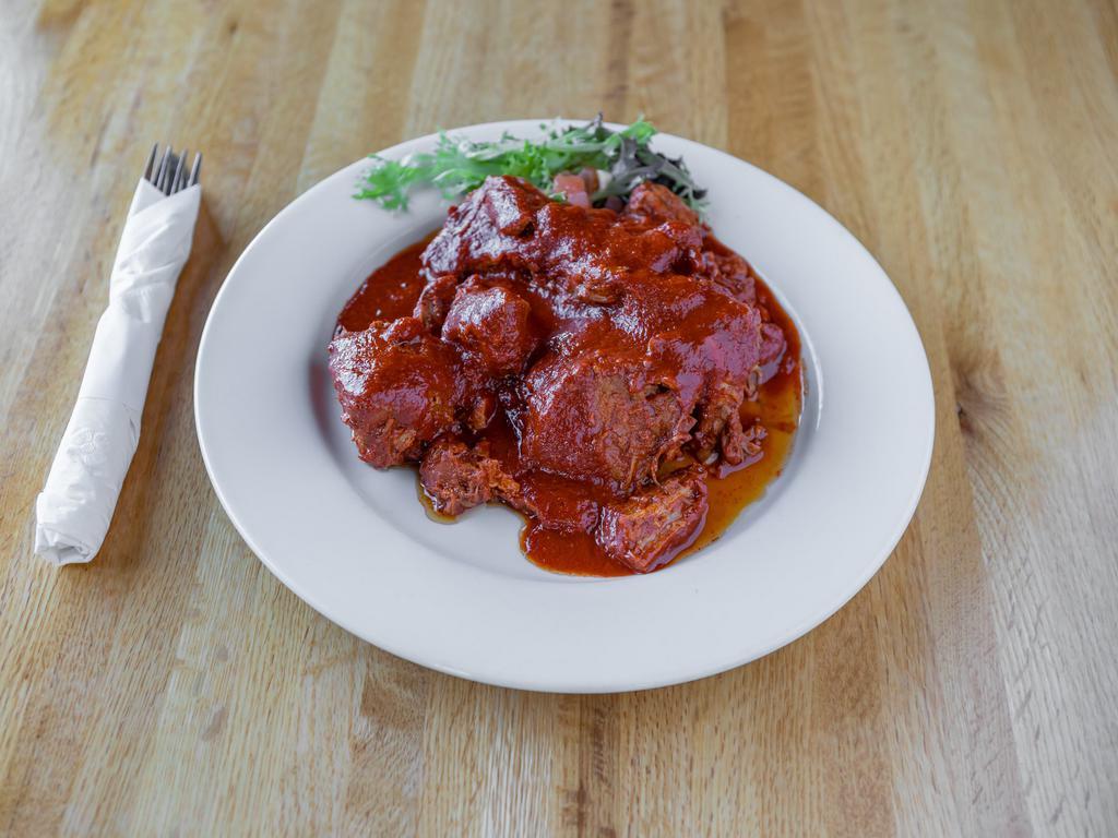Carne Adovada Plate · Pork cushion, brined 24 hours and marinated in special spices for 48 hours in Frank Sr.'s red chile.