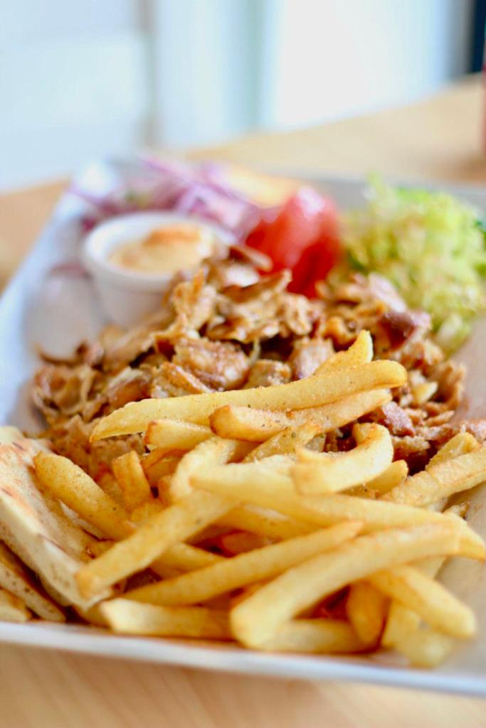 Chicken Gyro Platter · Thinly sliced marinated chicken gyro.All platters served with Tzatziki sauce or Niko's sauce, a side of handcut fries or rice, lettuce-tomato  salad and pita bread.
