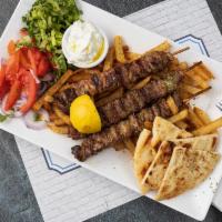 Pork Skewers Platter · Cubed marinated pork Skewers (3).All platters served with Tzatziki sauce or Niko's sauce, a ...