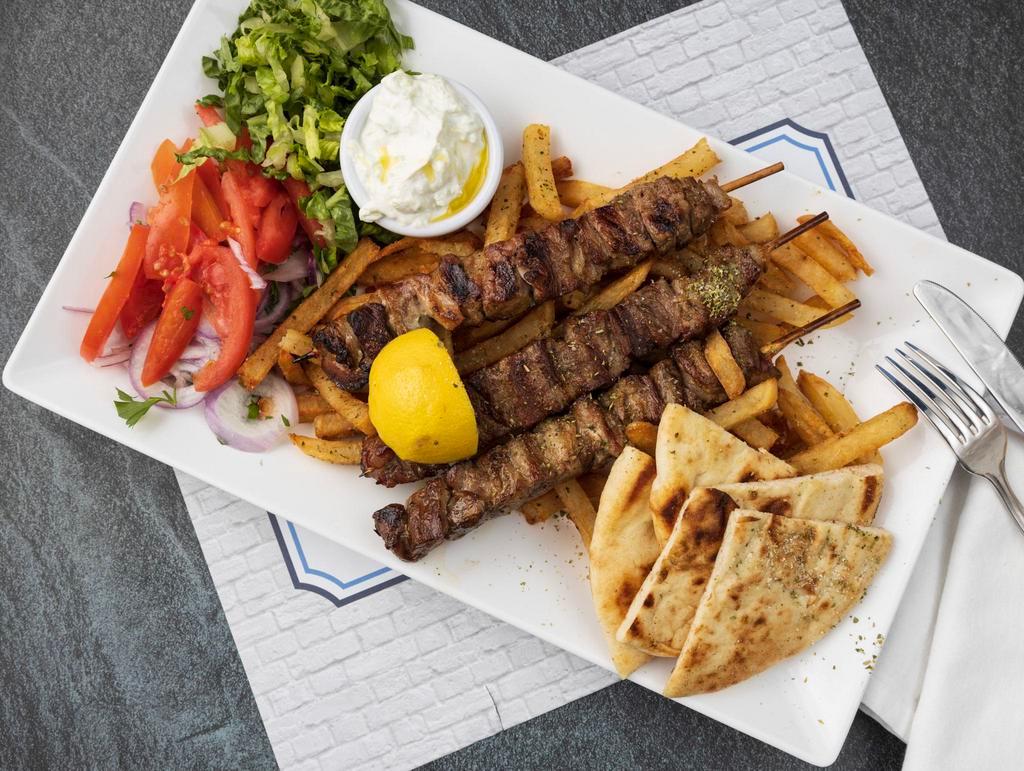 Pork Skewers Platter · Cubed marinated pork Skewers (3).All platters served with Tzatziki sauce or Niko's sauce, a side of handcut fries or rice, lettuce-tomato salad and pita bread.