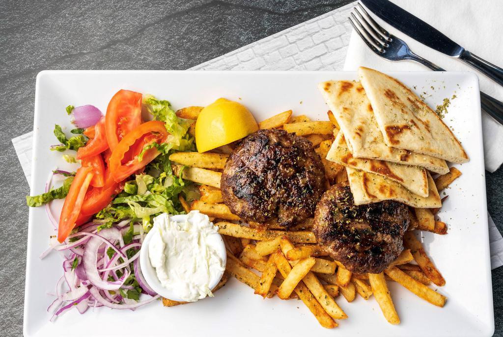 Biftekia Platter · 6oz ground beef patties (2).All platters served with Tzatziki sauce or Niko's sauce, a side of handcut fries or rice, lettuce-tomato salad and pita bread.