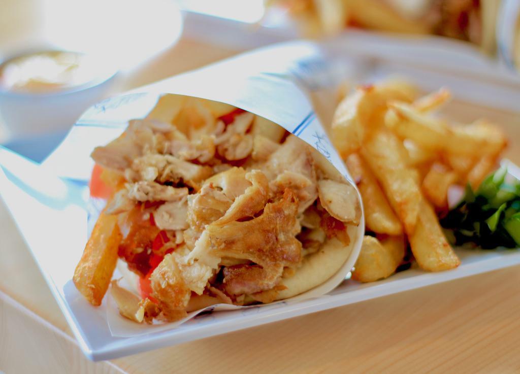 Chicken Gyro Pita · Thinly sliced marinated chicken, tomatoes, lettuce, fried and Niko' sauce.
