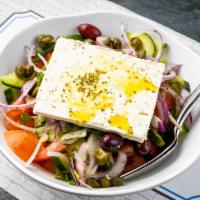 Horiatiki Salad · Tomatoes, cucumbers, red onions, green peppers, Kalamata olives,feta cheese and cappers. We ...