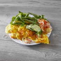 17. Banh Xeo · Vietnamese crispy pancake with shrimp, pork and bean sprouts, served with lettuce, mint leav...
