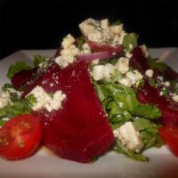 Barbabietole & Caprino · Roasted Beets over arugola salad , goat cheese and walnuts
 in a balsamic dressing