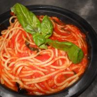Spaghetti al Pomodoro · Spaghetti tossed with fresh tomato sauce and basil. 