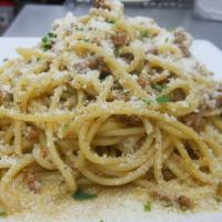 Spaghetti Cacio e Pepe · Olive oil, garlic, black pepper, and Pecorino cheese.