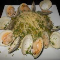 Spaghetti alle vongole  · Spaghetti tossed with clams in a white wine sauce , garlic and parsley 
