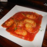 Ravioli al pomodoro · four cheese ravioli tossed in a fresh tomato sauce and basil 