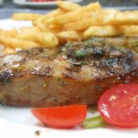 Bistecca alla Griglia  · Grilled strip loin steak marinated with herbs served with french fries 