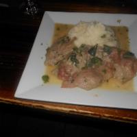 Saltimbocca di Pollo  · Chicken breast topped with prosciutto and sage in white wine sauce. Served with mashed potat...
