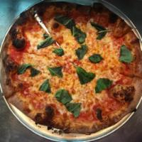 Margherita Pizza · Tomato sauce, fresh mozzarella cheese, and basil.