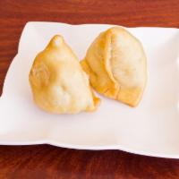 2 Piece Vegetable Samosas · Golden deep fried, flaky pastry filled with potatoes and peas.