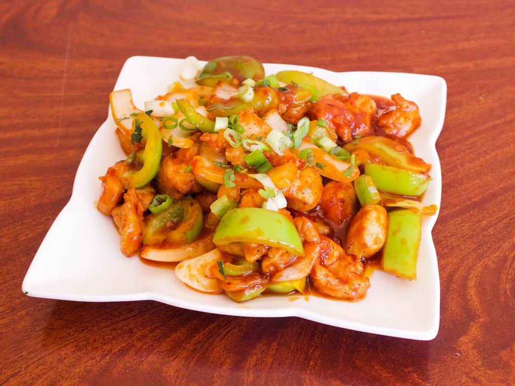 Chilly Chicken · Deep fried battered tender juicy chicken breast, onions and bell peppers stir fried in chilly sauce.