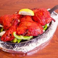 Tandoori Chicken 6 Pieces, · Chicken marinated in home made yogurt, spices and toasted it clay oven.