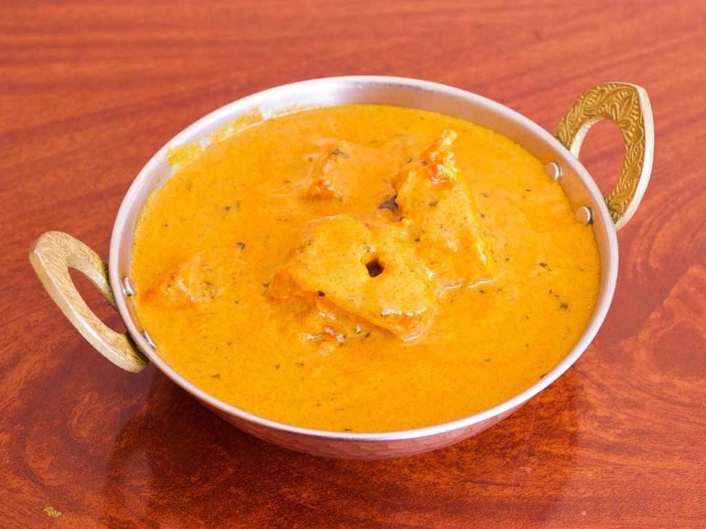 chicken Tikka Masala · Boneless chicken Breast cubes marinated in Ginger garlic sauce and spices grilled in clay oven, cooked in tomato onion cream sauce, 16Oz approx 1 Lb