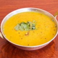 Dal Tadka · Yellow lentil tempered with cumin seeds, onions and spices.