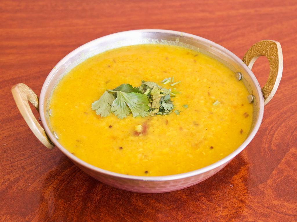 Dal Tadka · Yellow lentil tempered with cumin seeds, onions and spices.