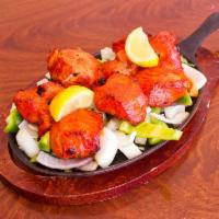 Chicken Tikka Kabab · Chicken marinated in yogurt, spices and roasted in clay oven.