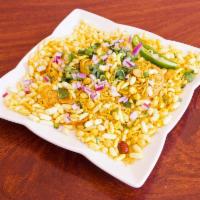 Bhel Puri · Rice puffs tossed with boiled potatoes, onions, spices and chutneys.