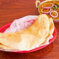 Bhature with Pindi Chana · Garbanzo beans cooked in special blend of spices with 2 deep fried puffed leavened bread.
