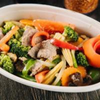 16. Mixed Vegetable Stir Fry · Broccoli, tomatoes, onions, carrots, mushrooms, baby corn, bell peppers, garlic