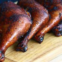 1/4 Smoked Chicken Plate · BBQ chicken served with 2 sides and bread.