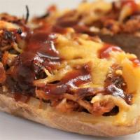 Spuds and Swine · Potato skins topped with chopped pork, cheese, seasoning and Bubba's signature sauce.