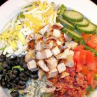 Cobb Salad · Fresh cut romaine lettuce topped with grilled chicken, bleu cheese, smoked bacon, cucumbers,...