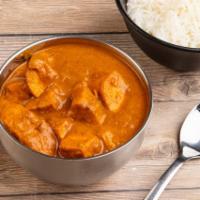 Chicken Curry · Boneless chicken cooked in classical onion gravy and Indian spices.