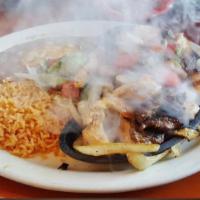 Carnitas Fajita · Served with rice, black or refried beans, salsa fresca, guacamole and choice of tortillas.