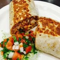 Fish Burrito · Grilled mahi-mahi, cabbage, pico de gallo, pinto beans, rice, shredded carrots and creamy ch...