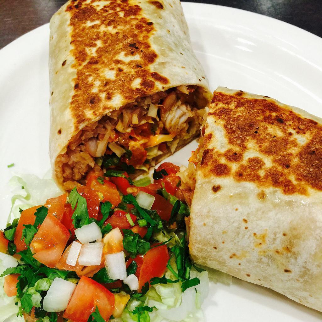 Fish Burrito · Grilled mahi-mahi, cabbage, pico de gallo, pinto beans, rice, shredded carrots and creamy chipotle sauce.