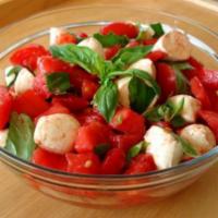Tomatoes & Fresh Mozzarella Salad · Tomatoes, fresh mozzarella, basil, roasted peppers, Romano cheese, and balsamic vinaigrette.