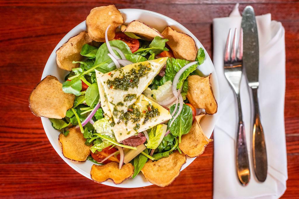 Jardin Salad · Marinated queso Blanco, watercress, baby spinach, romaine, grape tomato, Kalamata olives, red onions, red wine vinaigrette, and bonito chips. Vegetarian.