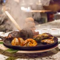 Plato Gaucho (For Two) · Skirt steak, Maine lobster tail, jumbo shrimp, free range grilled half chicken, and Cortez c...