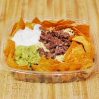 Carne Asada Chachos · Our version of Nachos, Includes cheese, sour cream, beans and guacamole.