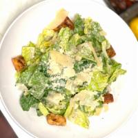Caesar Salad  · Romaine, Parmesan, garlic croutons and Caesar dressing. 