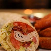 Gobbler · Turkey, bacon, lettuce, tomato, garlic mayo and flour wrap.