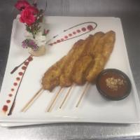 8. Chicken Satay · Marinated chicken skewers seasoned in coconut cream and curry powder. Served with peanut sau...
