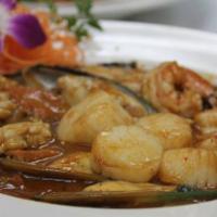 6. Thai Chili Tamarind Seafood · Fresh Thai basil, stir fried with scallop, shrimp, squid, musscle, chili, pepper, onion, car...