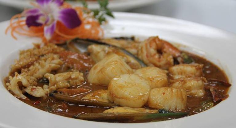 6. Thai Chili Tamarind Seafood · Fresh Thai basil, stir fried with scallop, shrimp, squid, musscle, chili, pepper, onion, carrots, broccoli in Thai basil sauce. Spicy.
