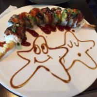 8. Dragon Roll · Tempura shrimp, cucumber topped with unagi, crab meat, avocado and unagi sauce.