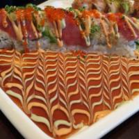 11. Four Seasons Roll · Unagi and cucumber topped with real crab, tuna, avocado, tobiko and special sauce.